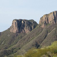 Cerro Cacharamba in Alamos mining district.  Large exposed inner volcanic formation eroded to its core.