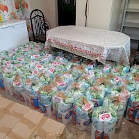 Providing food and sanitary supply packages to the local community